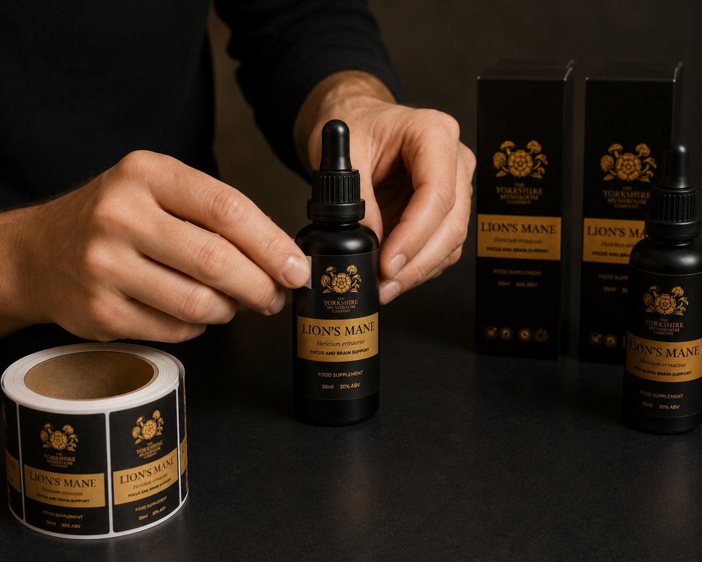Hand-bottling medicinal mushroom tincture in black-dipped UV-blocking amber glass droppers